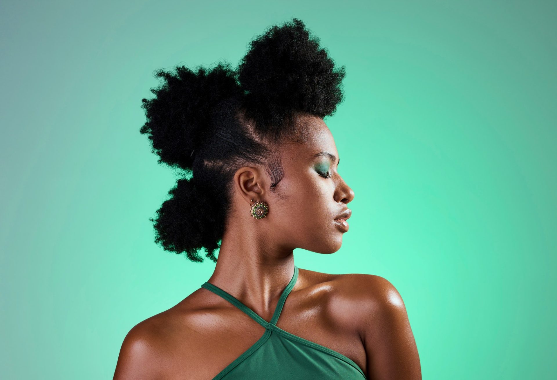 Black woman, makeup and face on skin for beauty, fashion and cosmetics against green backdrop. Mode
